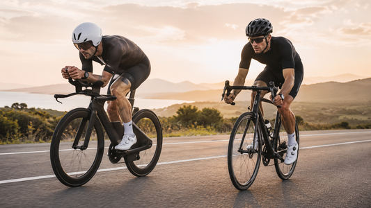 Triathlon bike and road bike being ridden side by side on an open road