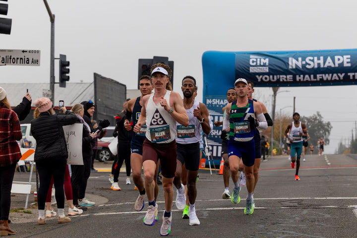 Runners approaching the finish at a half marathon road race