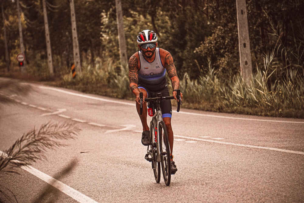 Beginner road cyclist training on an open road