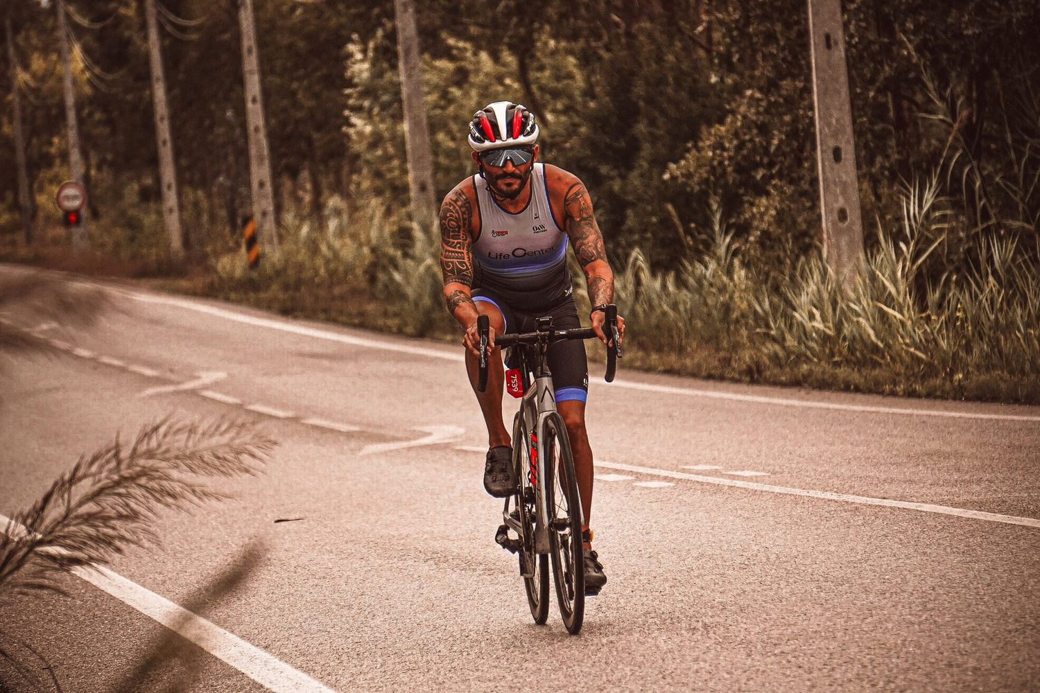 Beginner road cyclist training on an open road