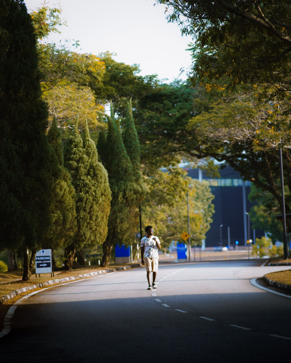 Runner jogging at an easy pace on a quiet park road