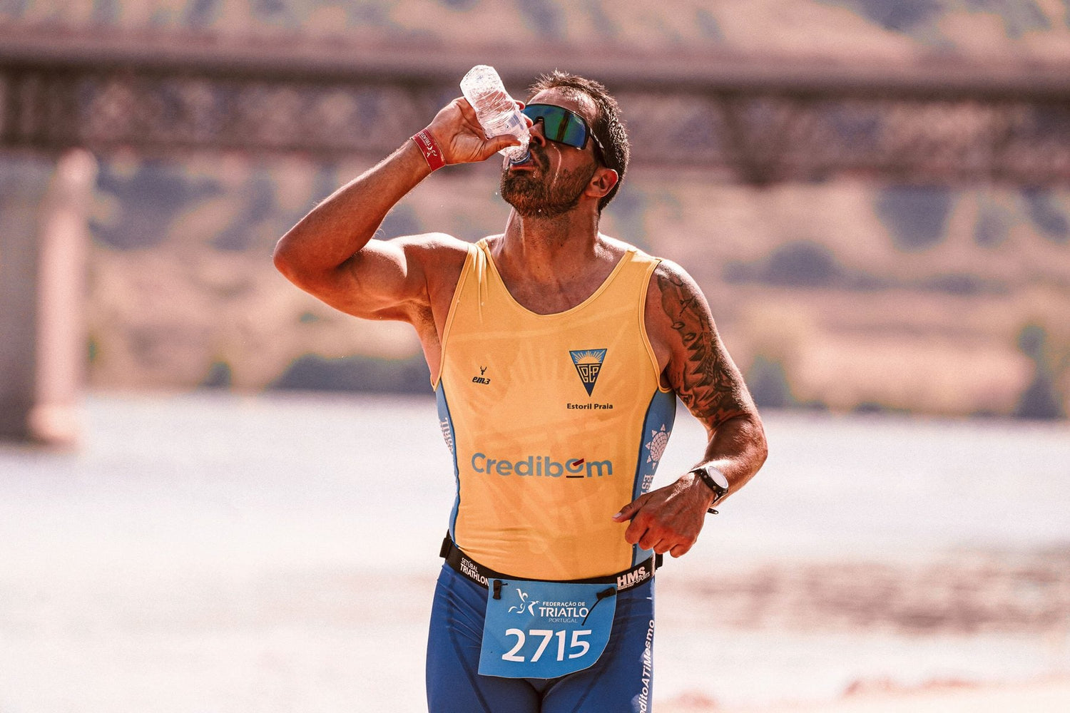 Runner drinking water during a hot outdoor race