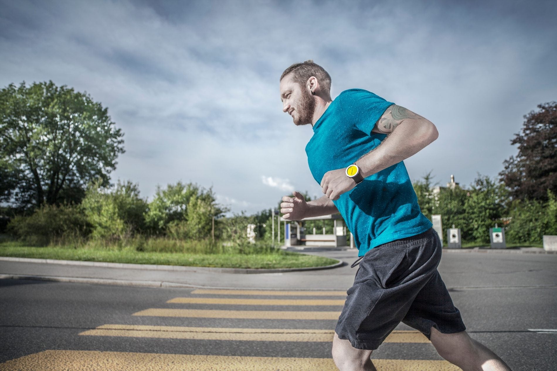 Runner wearing a sports watch during an outdoor training session