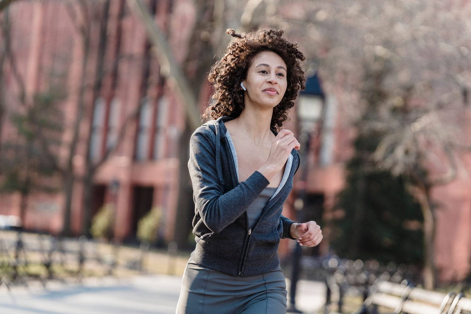 Beginner runner training on a green park path