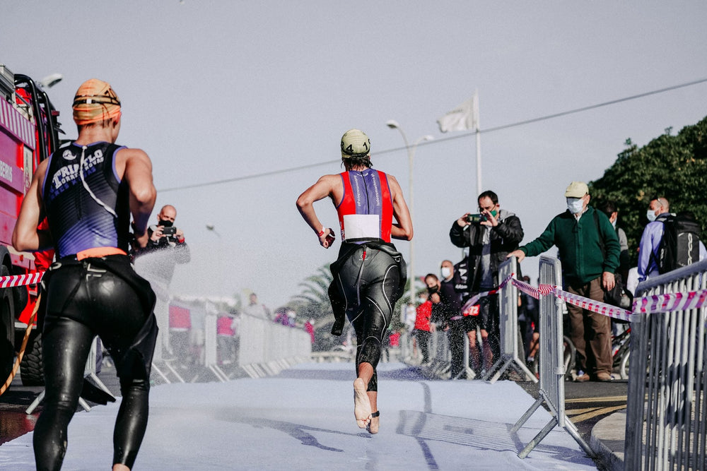 Triathletes racing together during a long-distance event