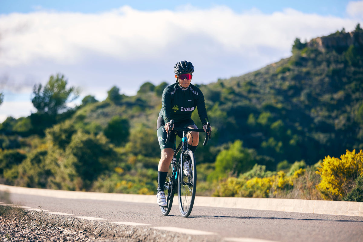 Road cyclist riding on a scenic rural road during a long endurance ride