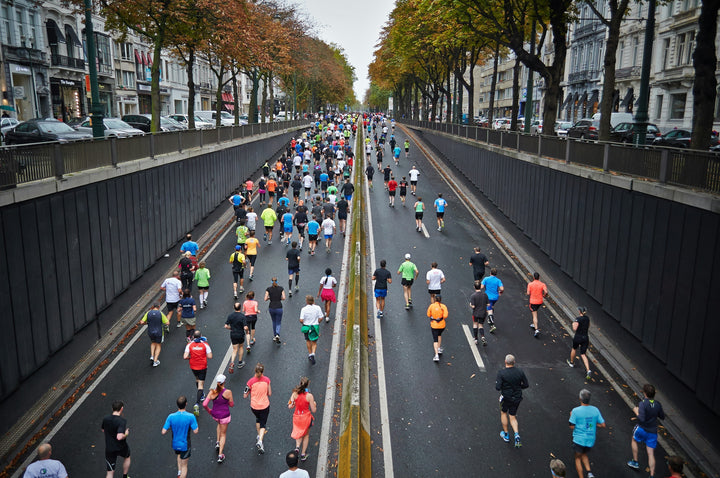 Runner training on the road for a 16-week marathon training plan