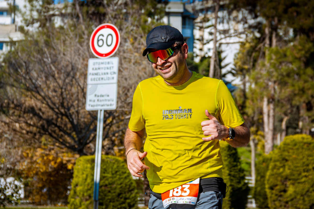 Triathlete running during a long-distance triathlon race