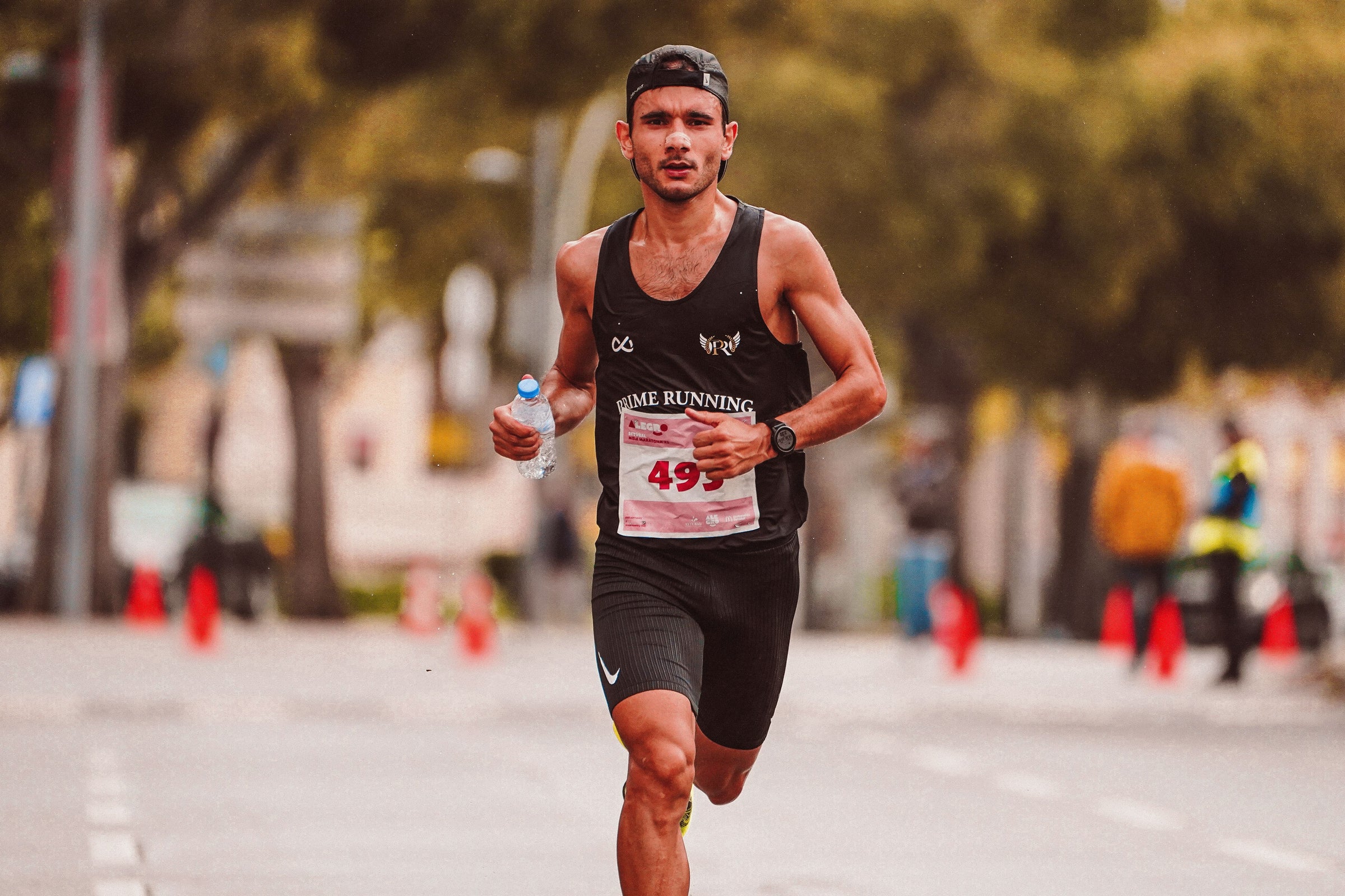 Runner maintaining a controlled pace during a 5K race