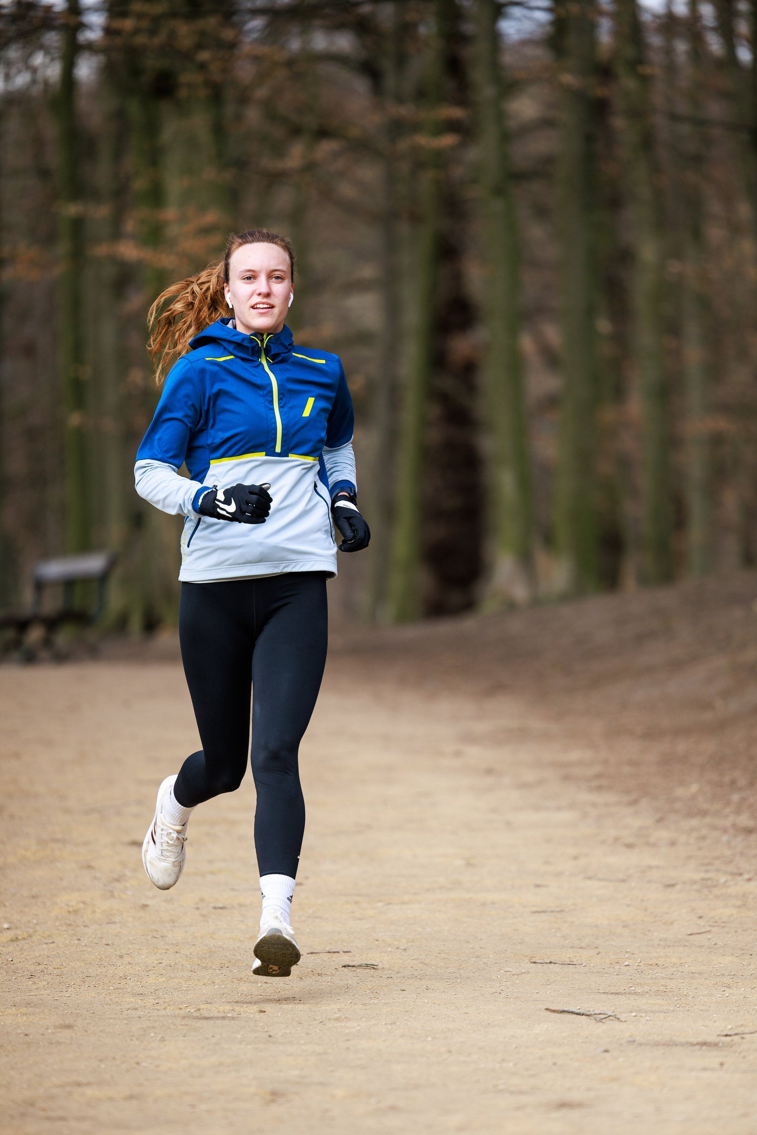 Runner practicing a relaxed stride in a park