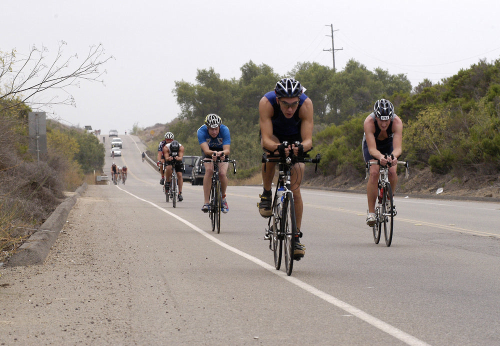 Cyclists riding hard during a triathlon bike leg