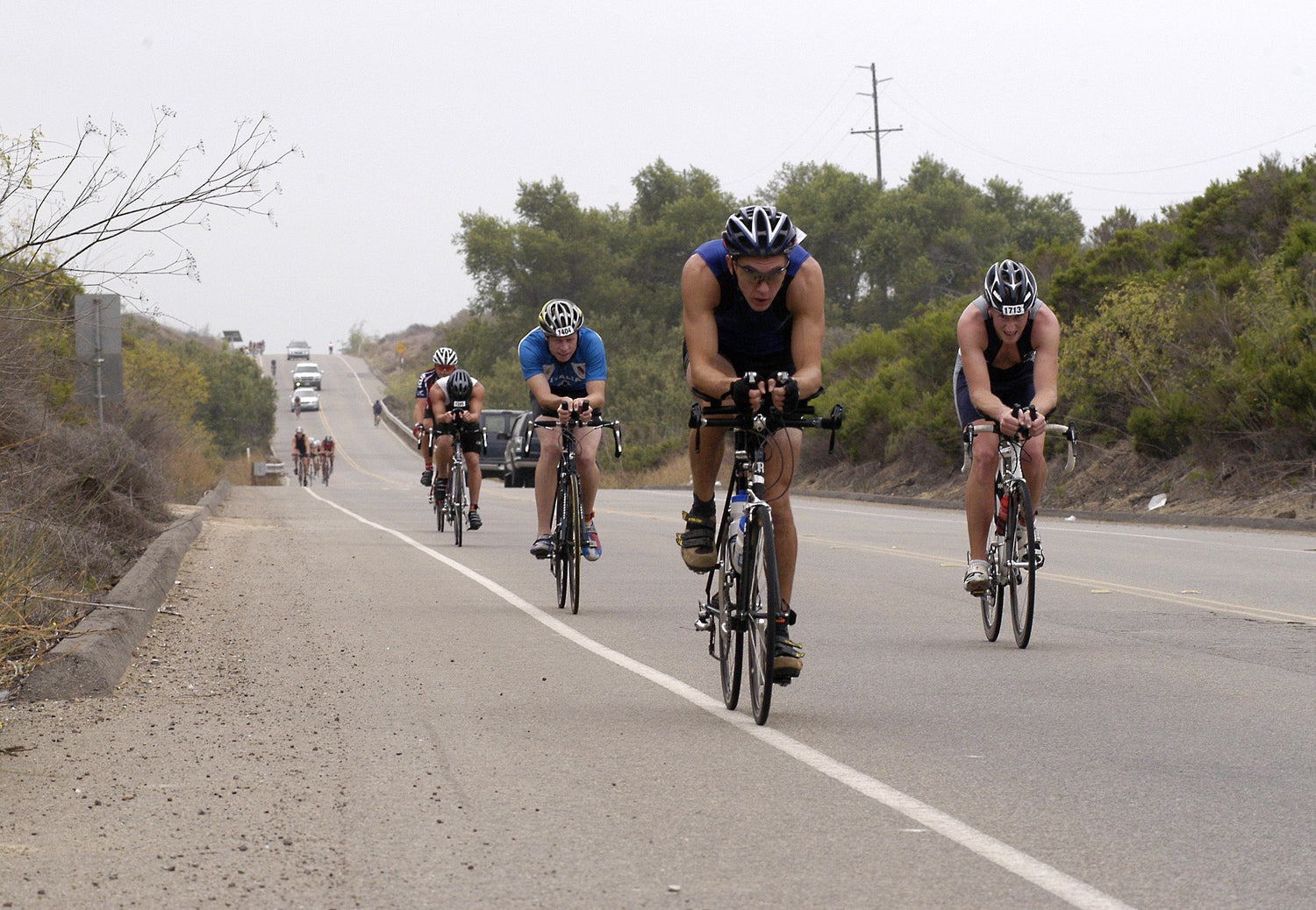 Cyclists riding hard during a triathlon bike leg