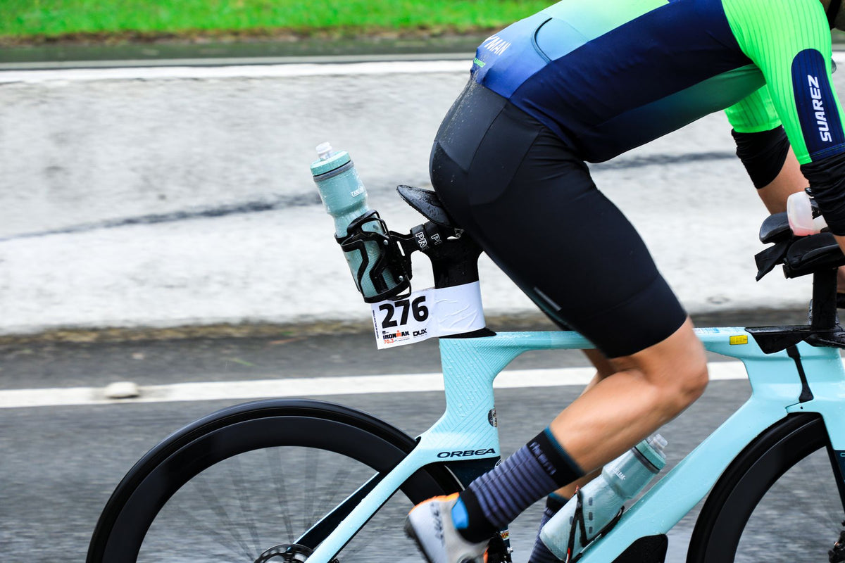 Triathlete racing with bottles mounted behind the saddle and inside the bike frame