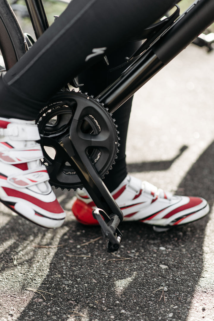 Cyclist using cycling shoes and pedals on a road bike